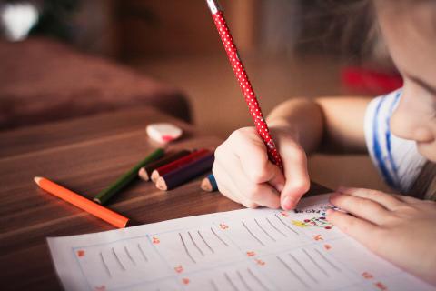 Image of young girl writing 